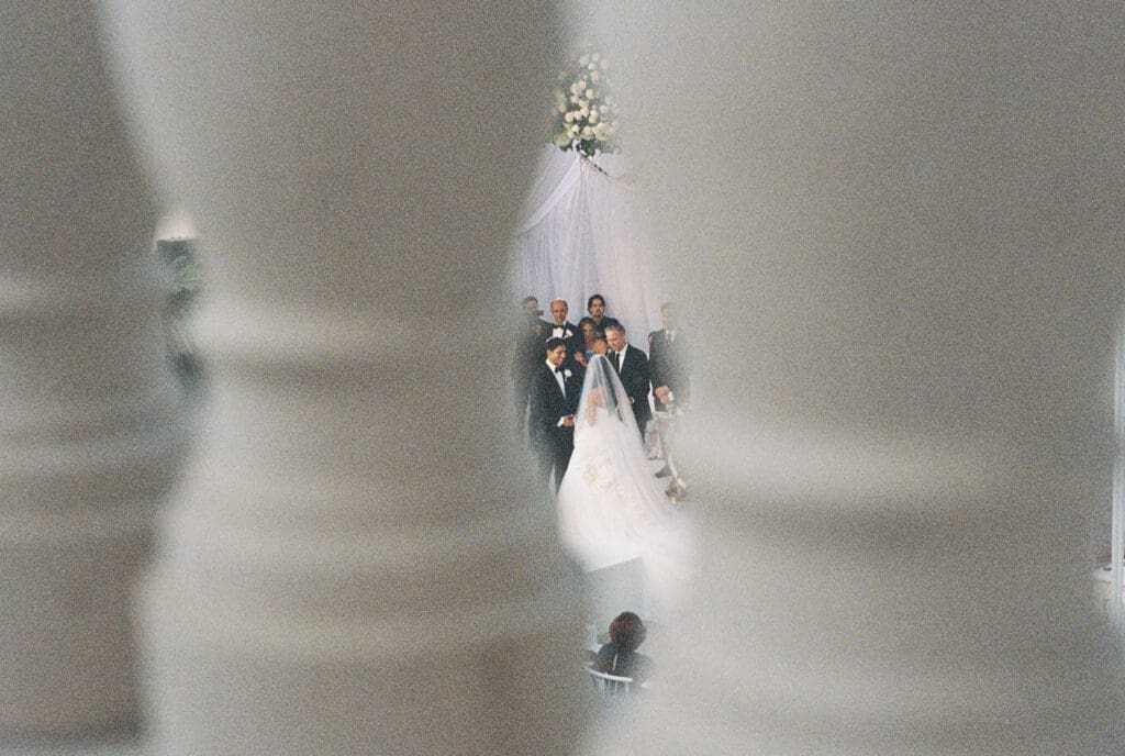 Film portrait of a couple during their ceremony in Beverly Hills, CA shot on Canon AE-1 on Kodak Portra 800.