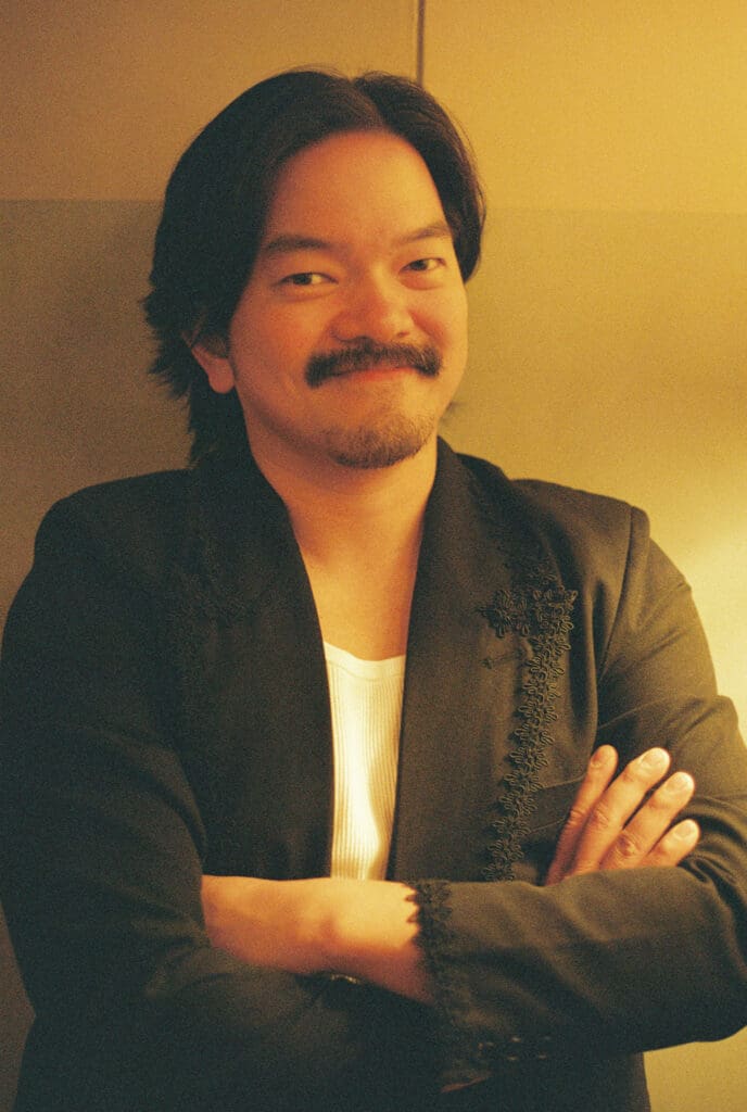 Getting ready of groom shot in warm light on film at the Proper Hotel in DTLA.